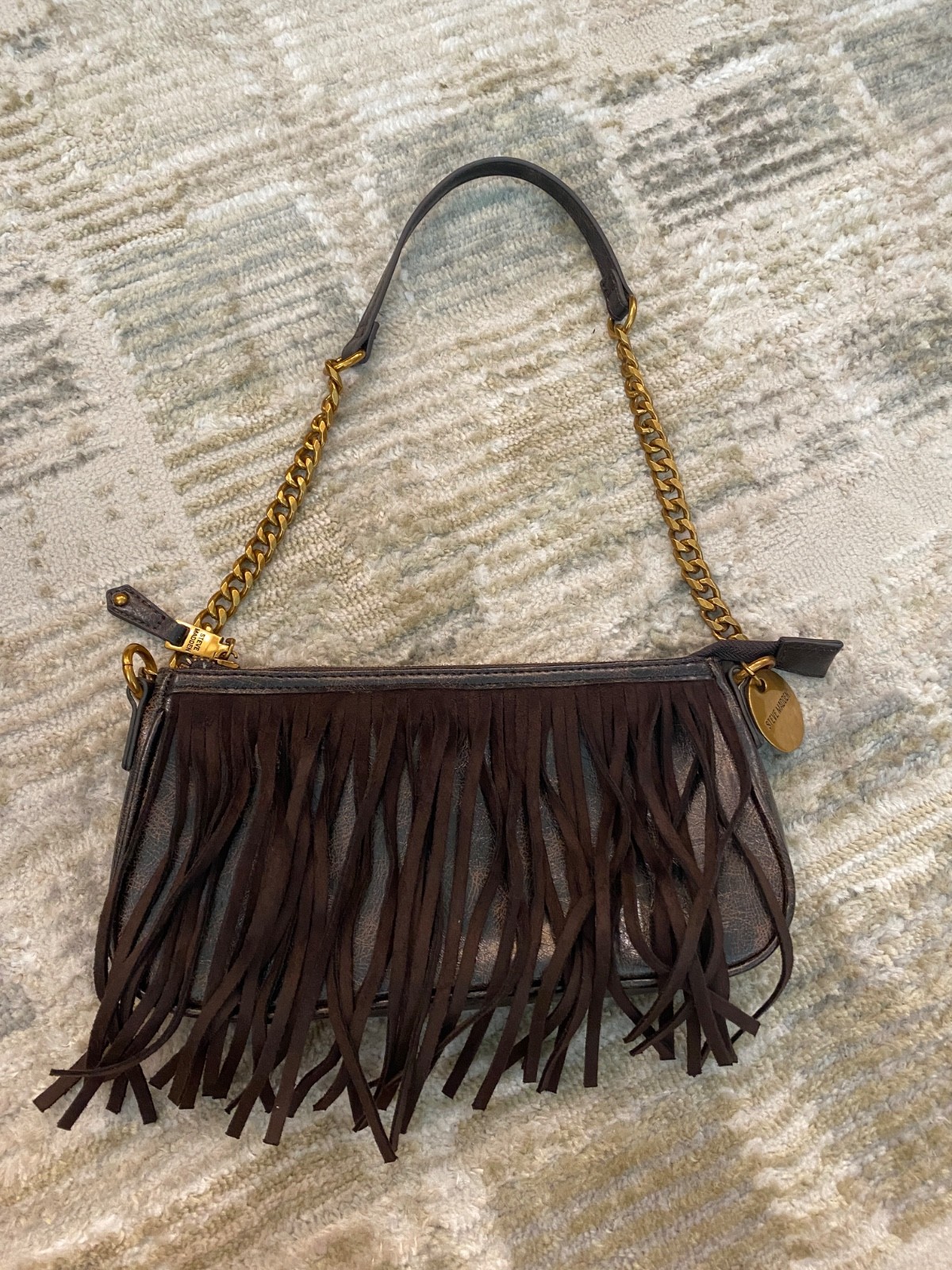 Steve Madden brown fringe crossbody bag accented with gold-tone hardware