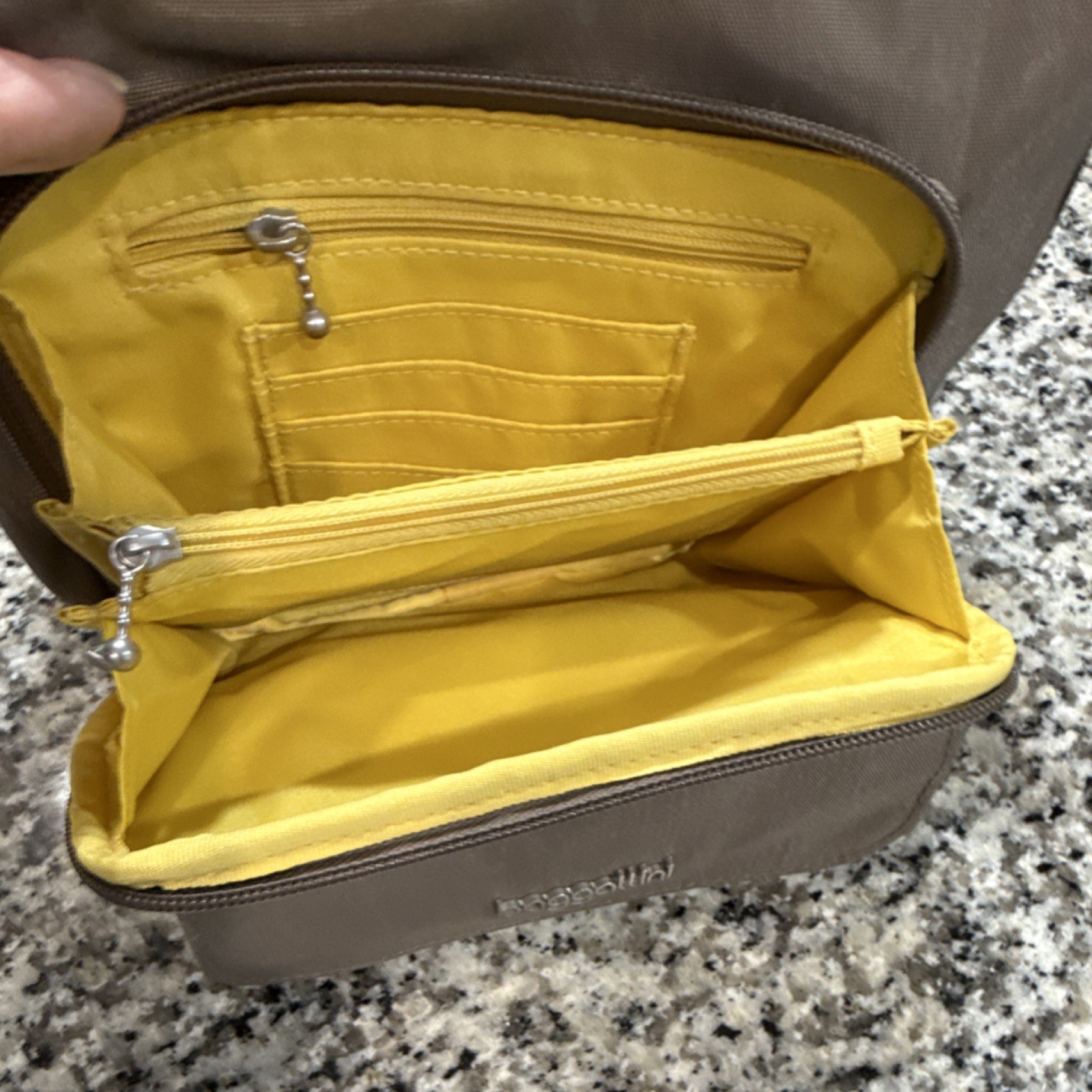 Baggallini Brown Crossbody Bag Zip Top Adjustable Strap Pockets Yellow Lining